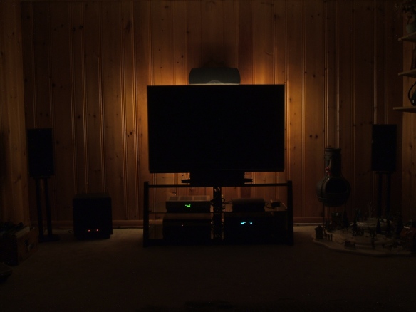 Wide shot, blank TV screen, indirect lighting
